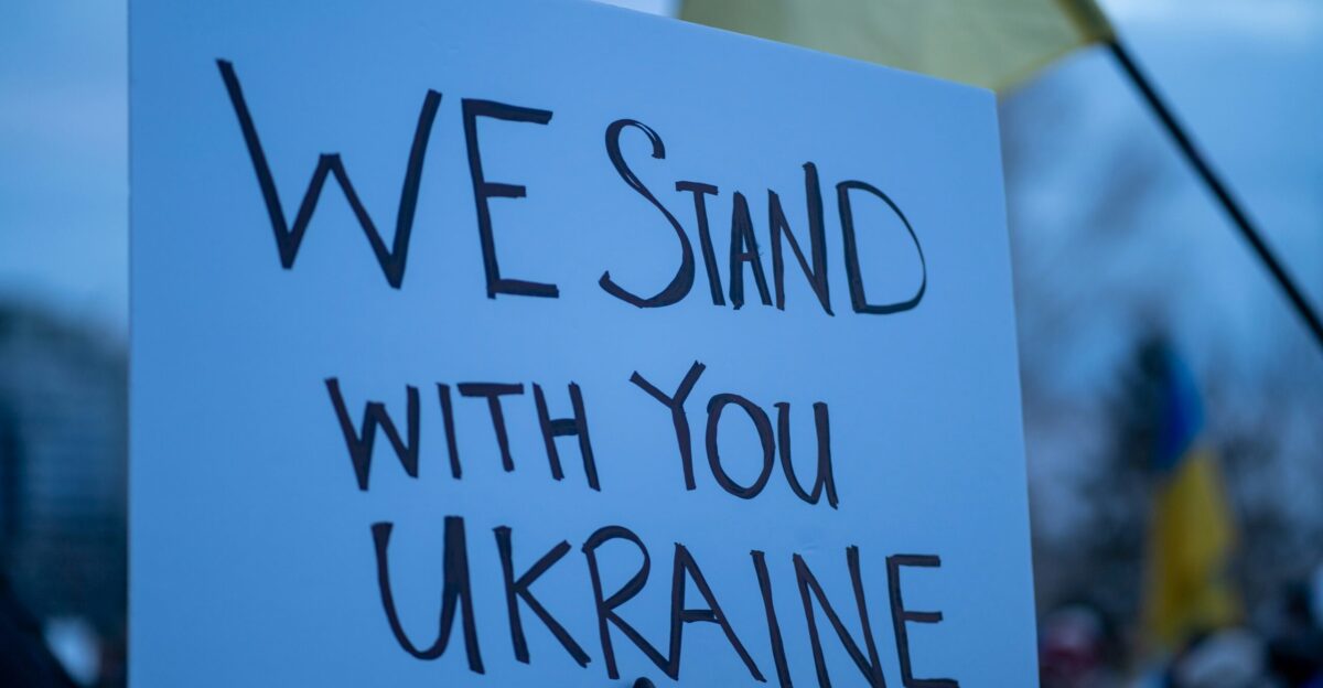 a sign that says we stand with you ukraine