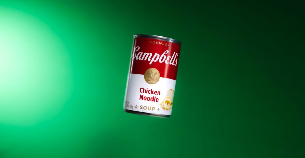 a can of rambulu chicken noodle soup on a green background