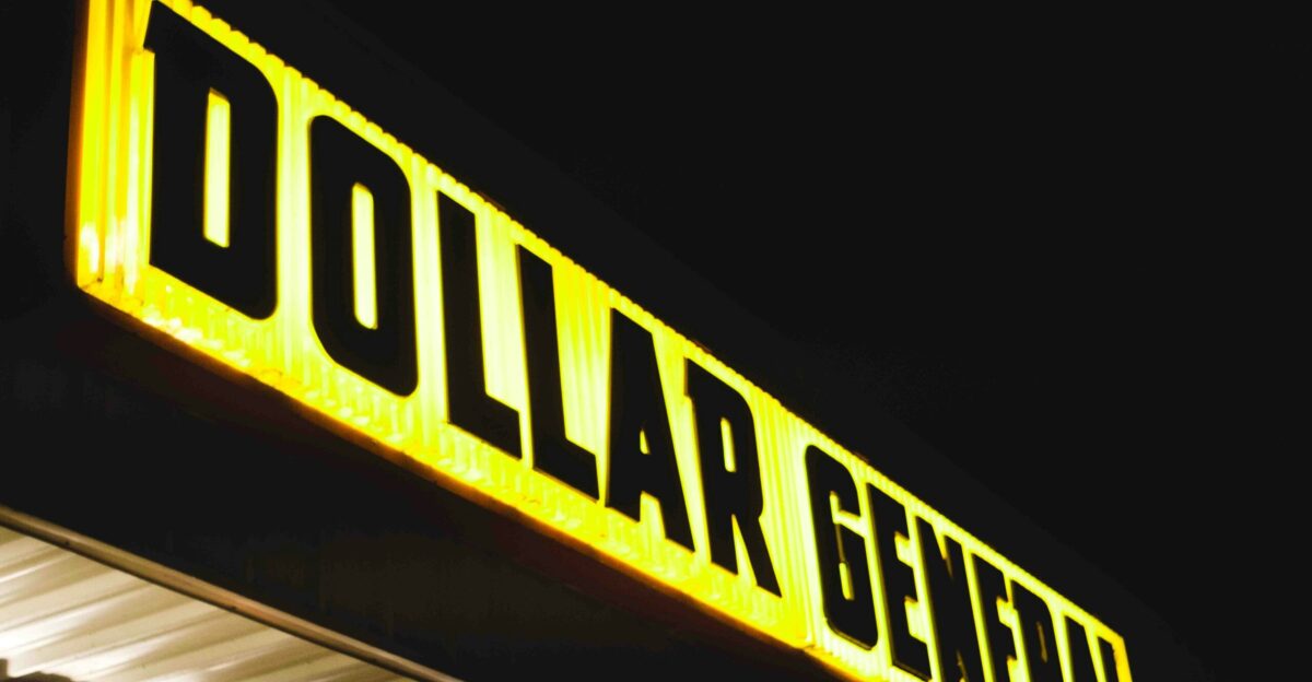 a dollar general store sign lit up at night