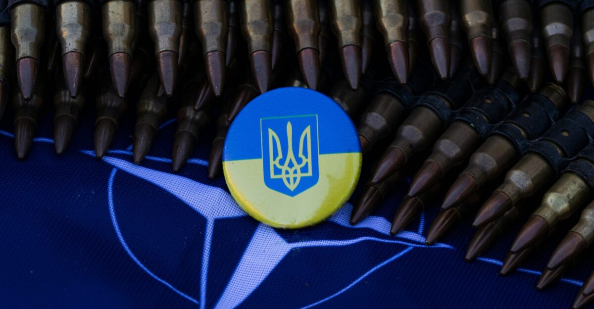 a blue and yellow button sitting on top of a table