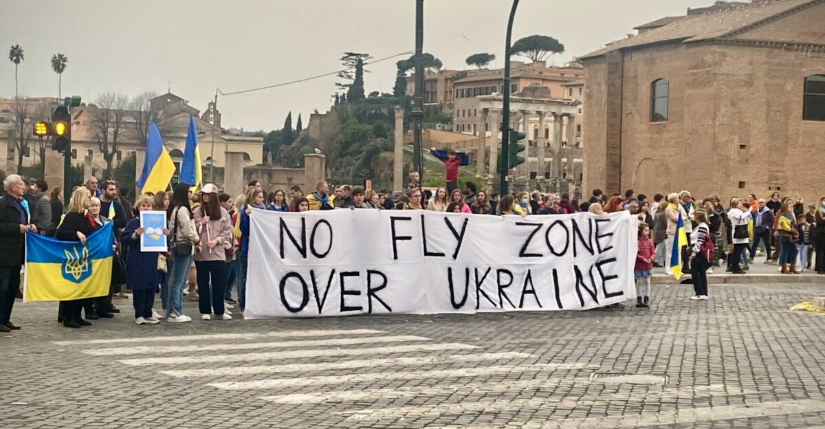 a group of people holding a sign