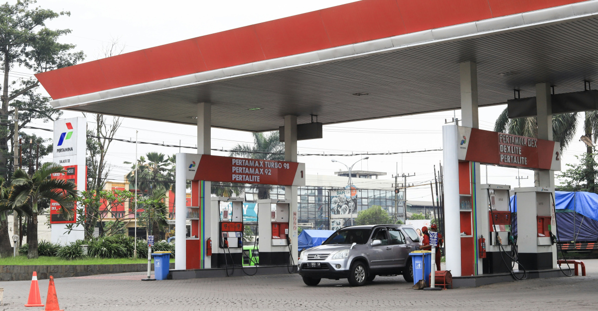 a car is parked at a gas station