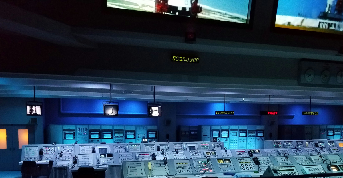 a room with many screens and monitors