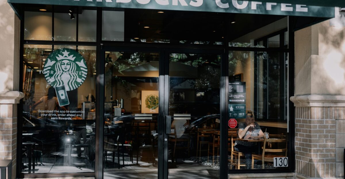 a starbucks coffee shop with a person sitting at a table
