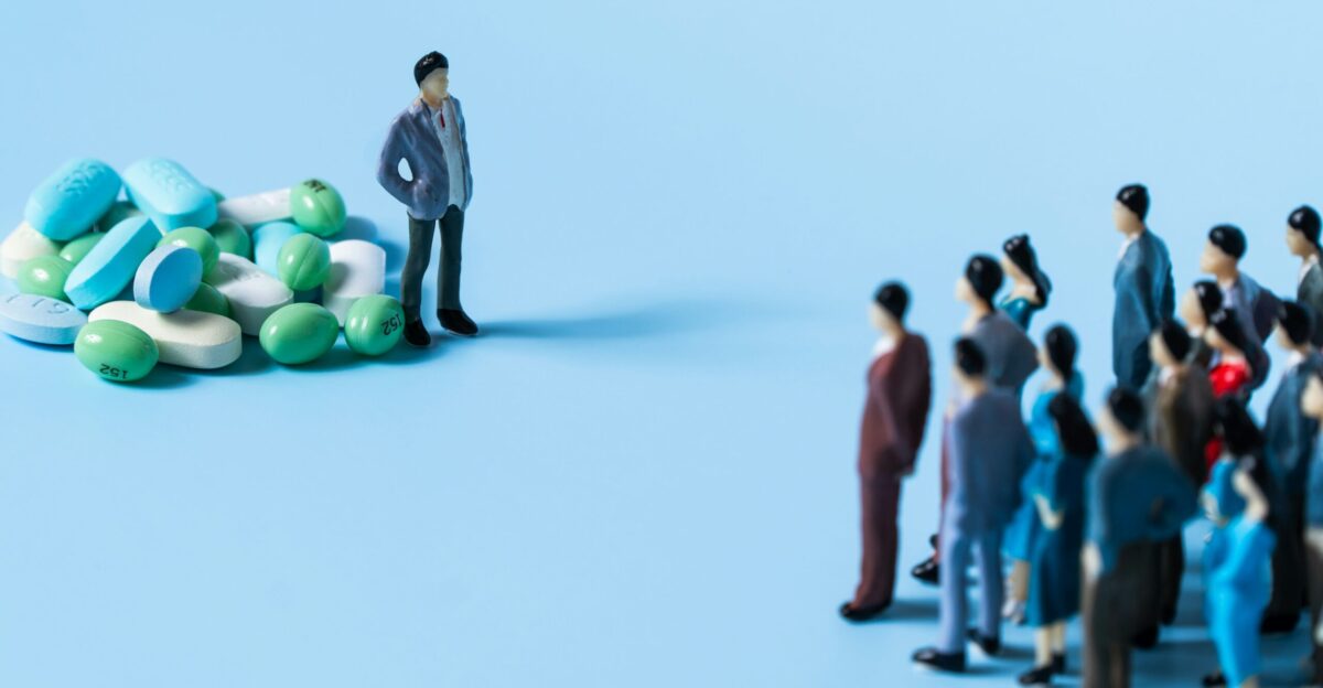 a person standing on a group of people holding balloons