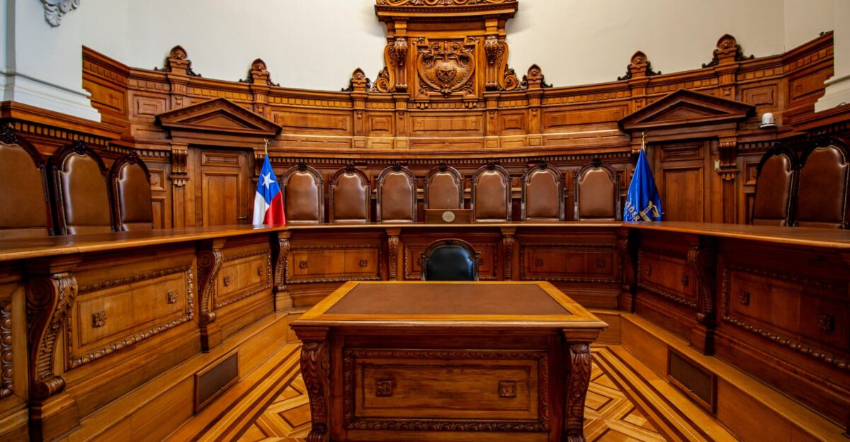 a courtroom with a large wooden bench