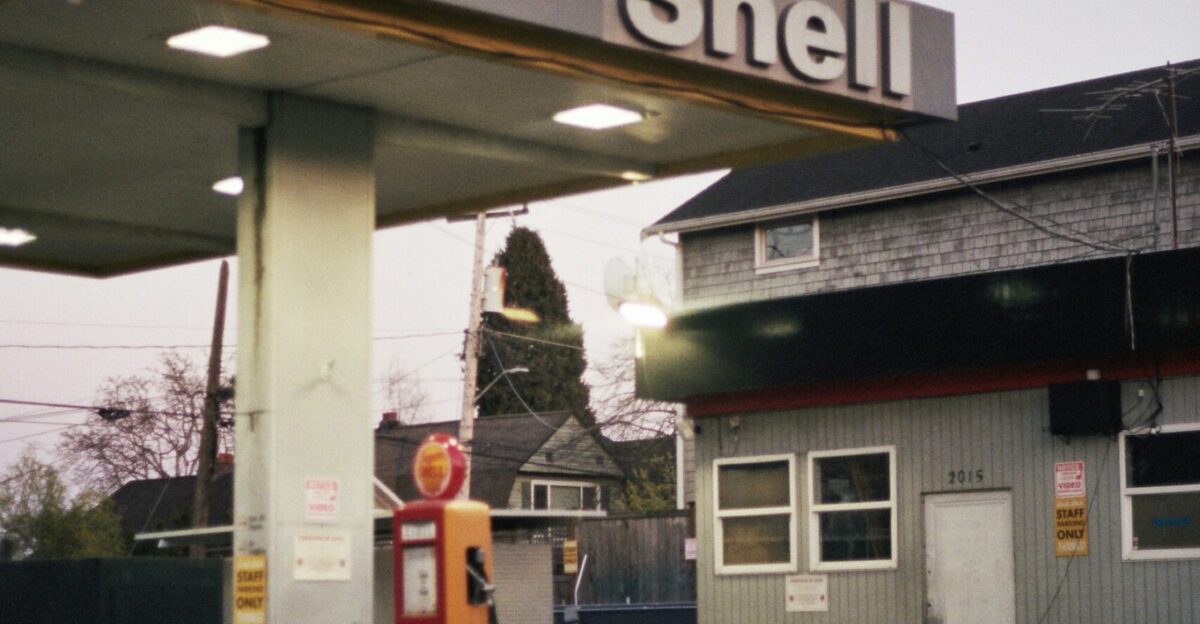 a gas station with a sign