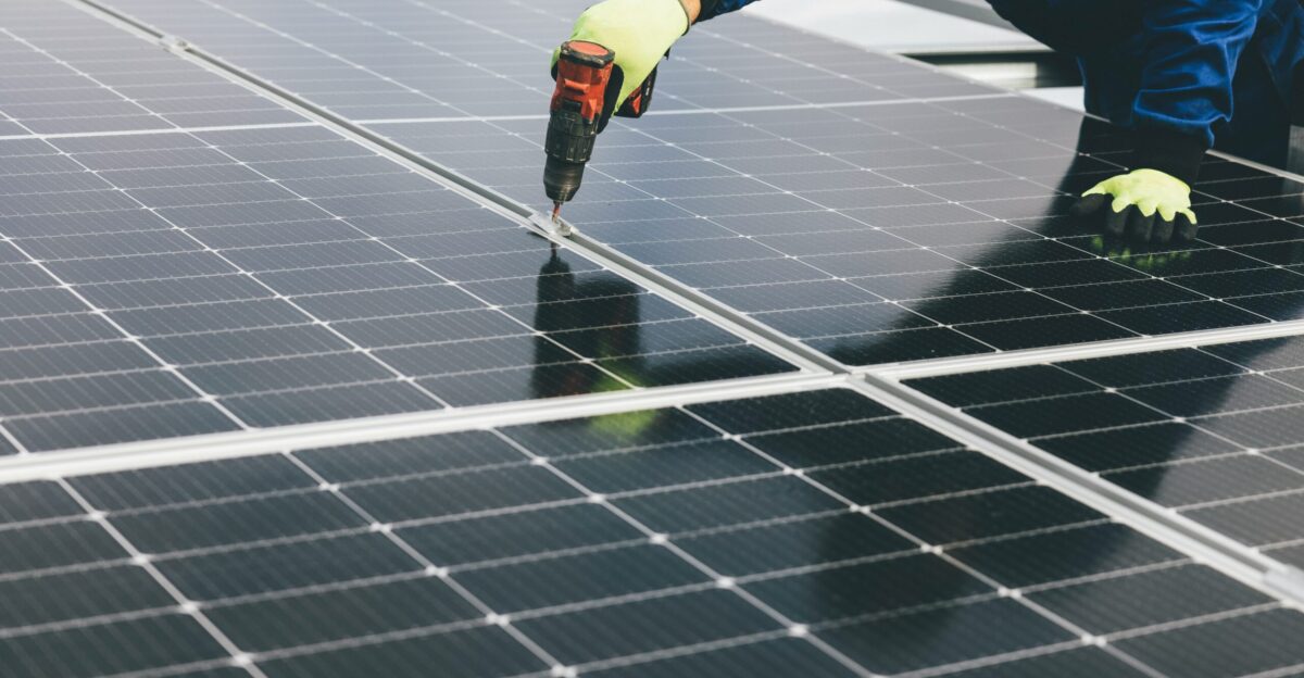 a person working on a solar panel