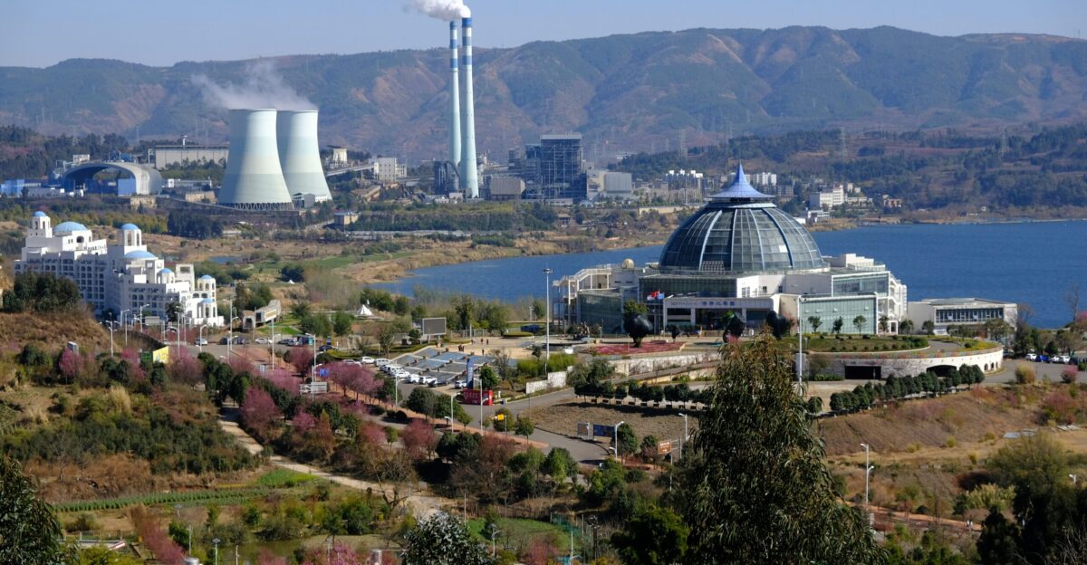 a view of a city with a lake in the foreground