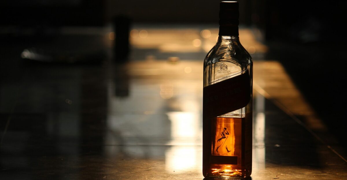 a bottle of alcohol sitting on top of a table