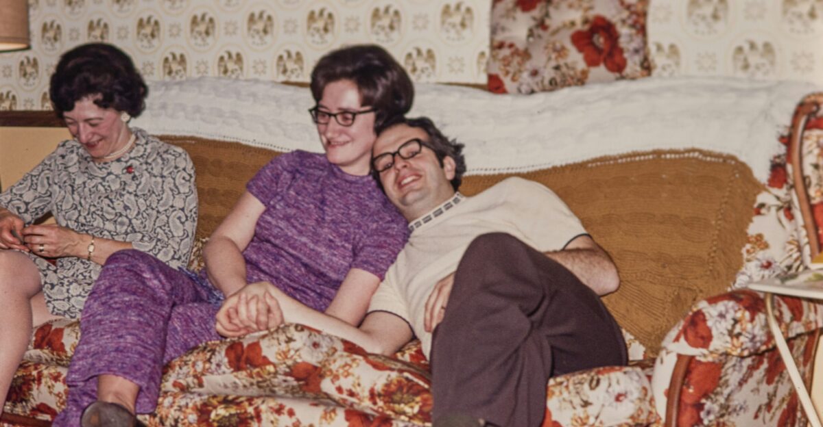 a group of people sitting on top of a couch