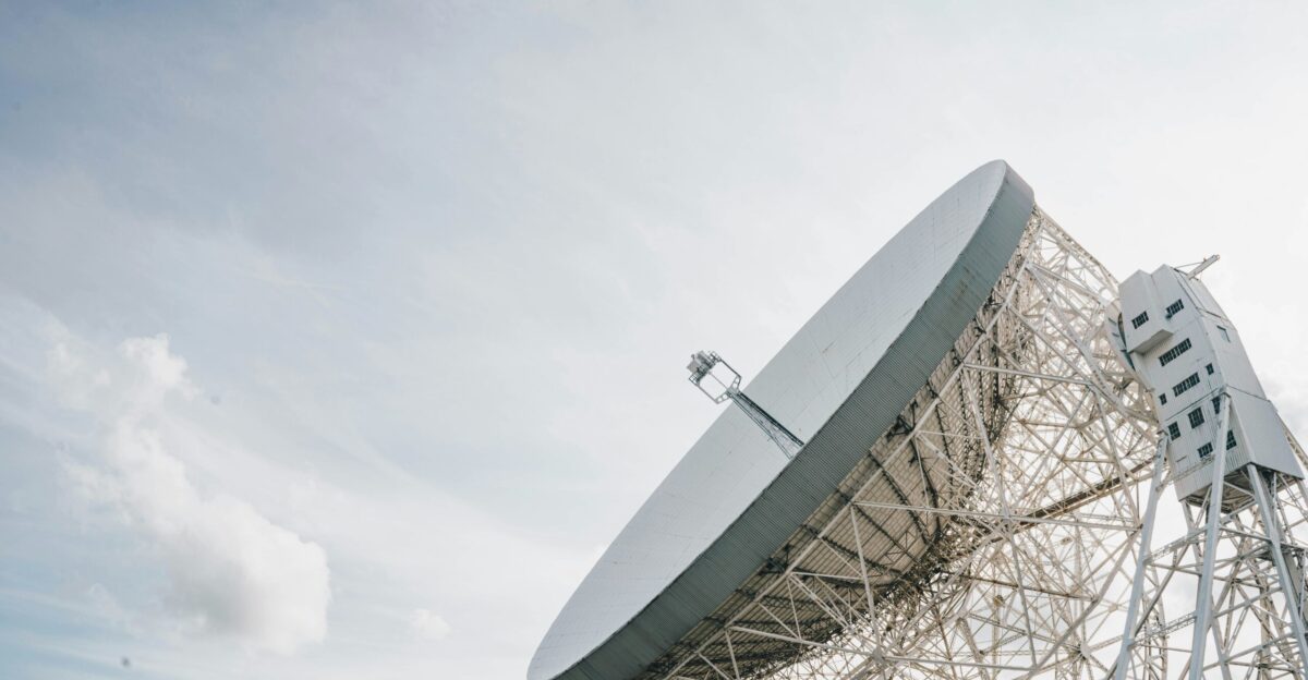 a large satellite dish sitting on top of a metal structure