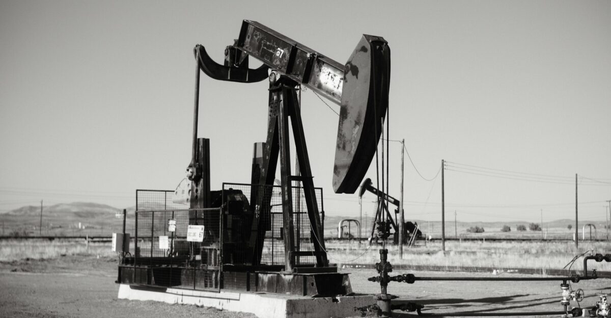 a black and white photo of an oil pump