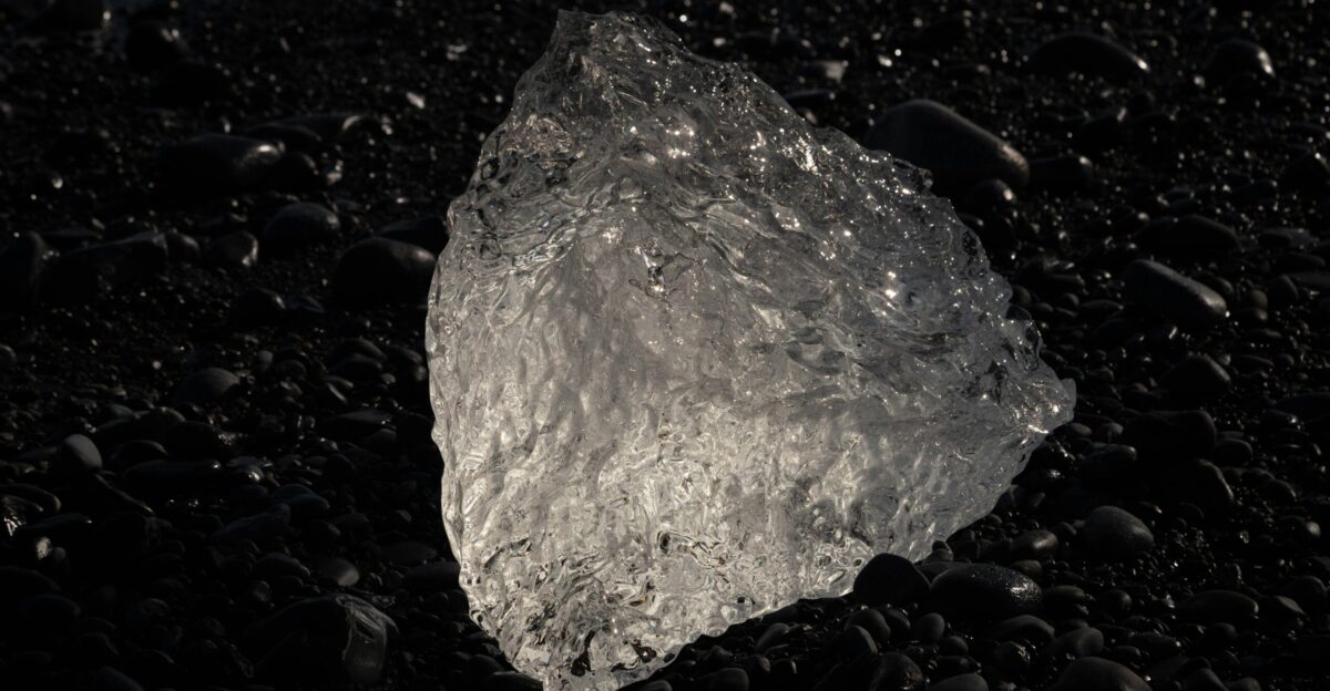 a large rock sitting on top of a black ground