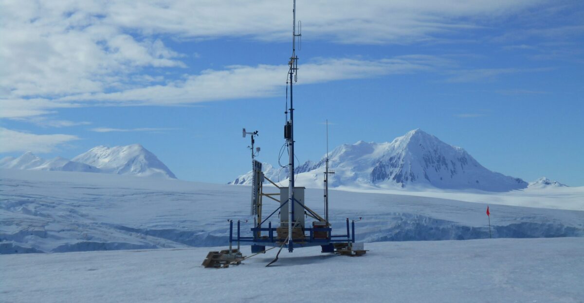 a very tall tower sitting on top of a snow covered slope