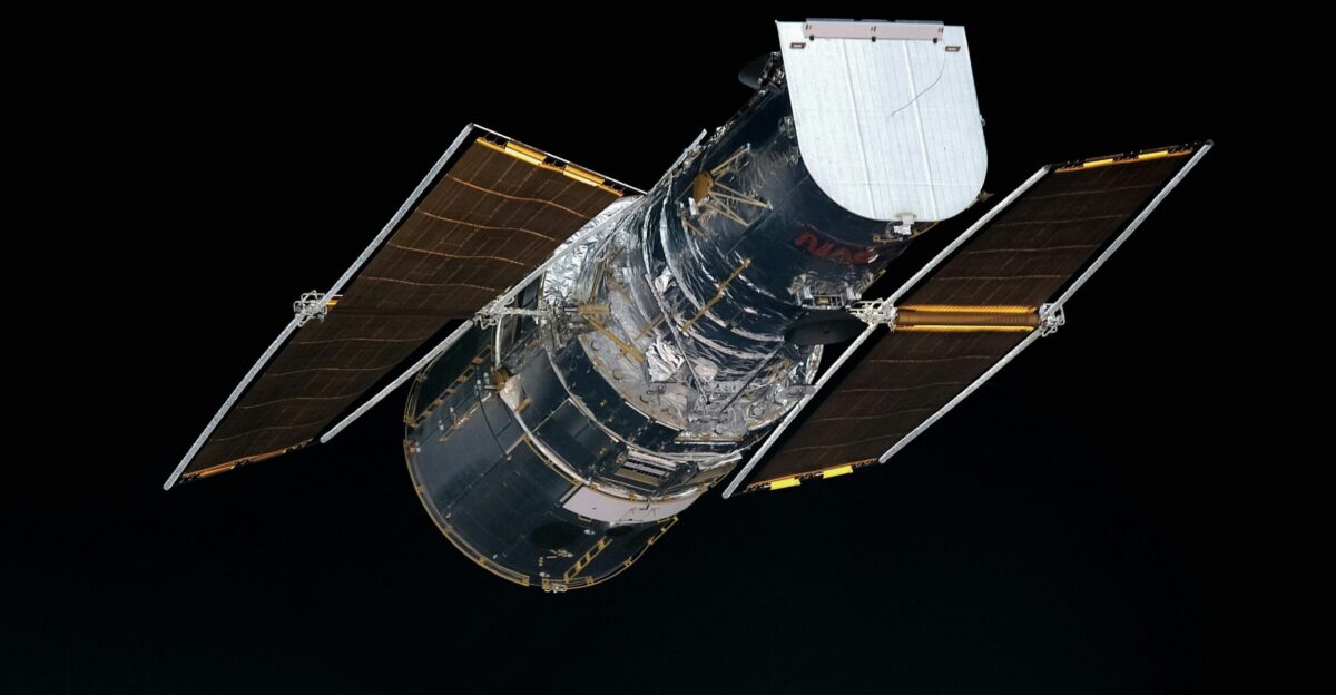 a satellite in the dark with a black background