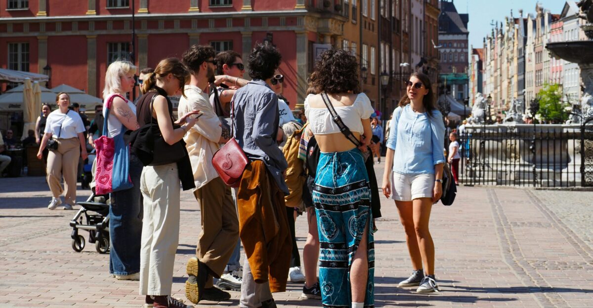 a group of people standing around each other