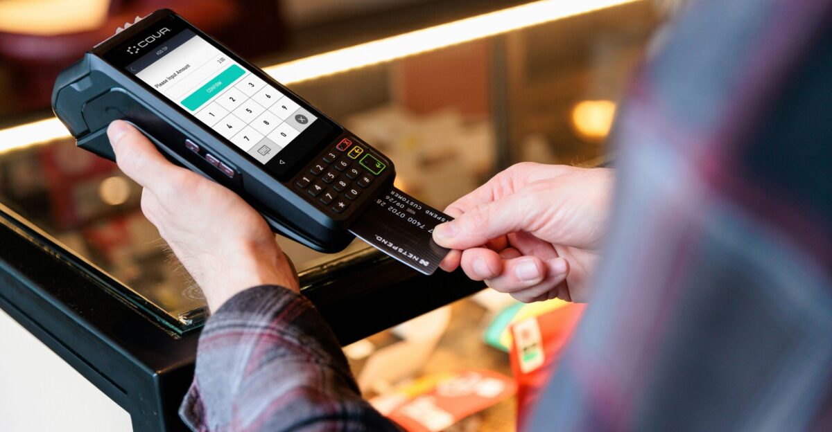 a person holding a cell phone in their hand