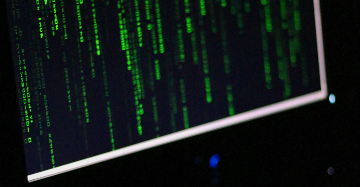 A computer monitor sitting on top of a desk