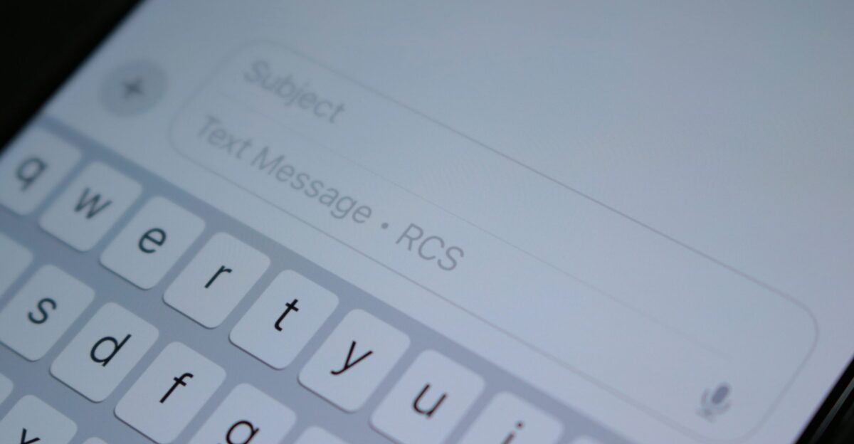 A close up of a cell phone with a keyboard