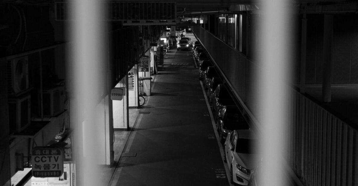 A black and white photo of a train station