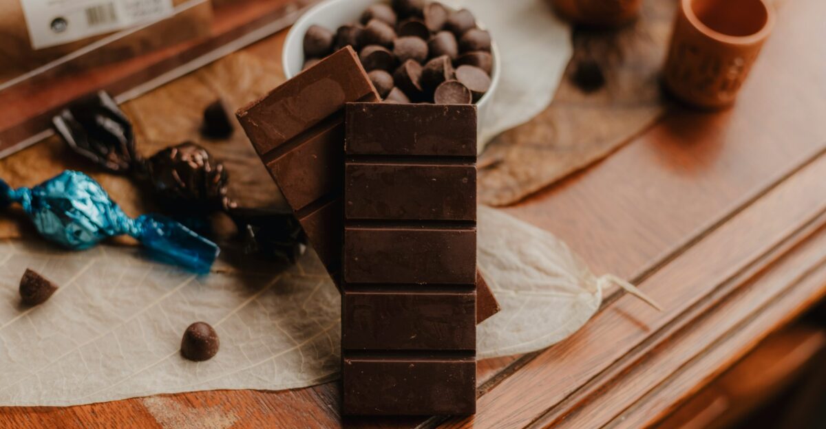 A table topped with a bowl of chocolate