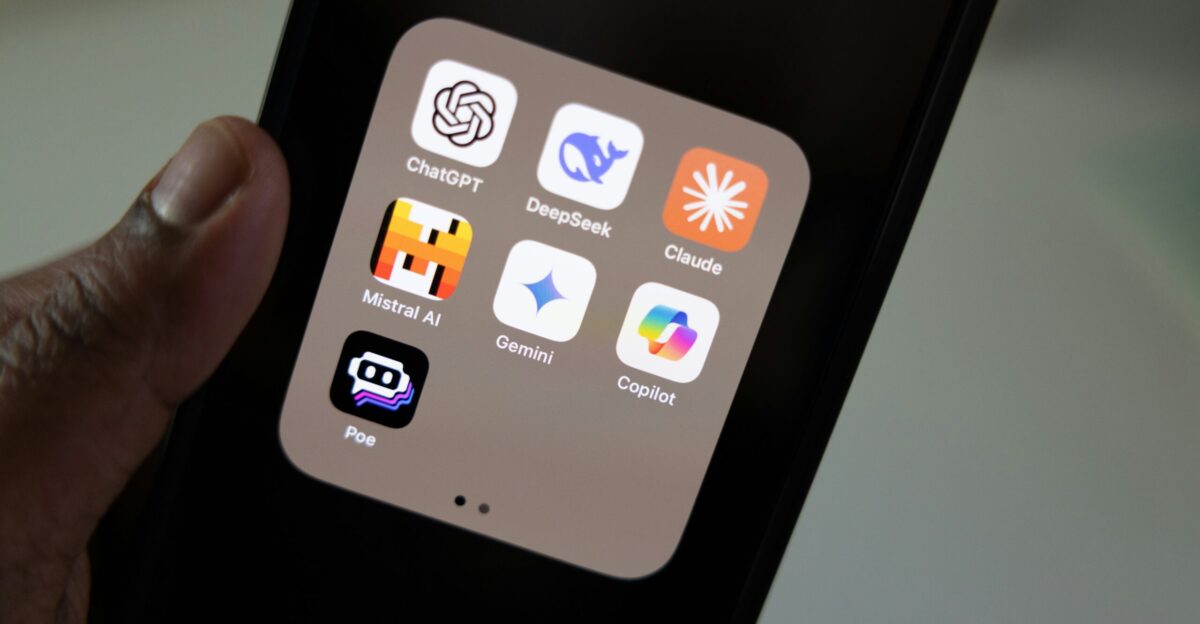 A person holding a smart phone in their hand