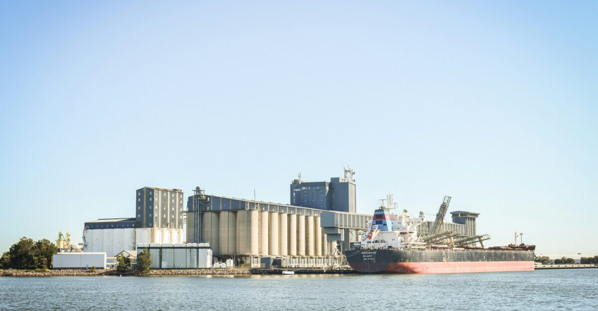 A large ship is docked in a harbor