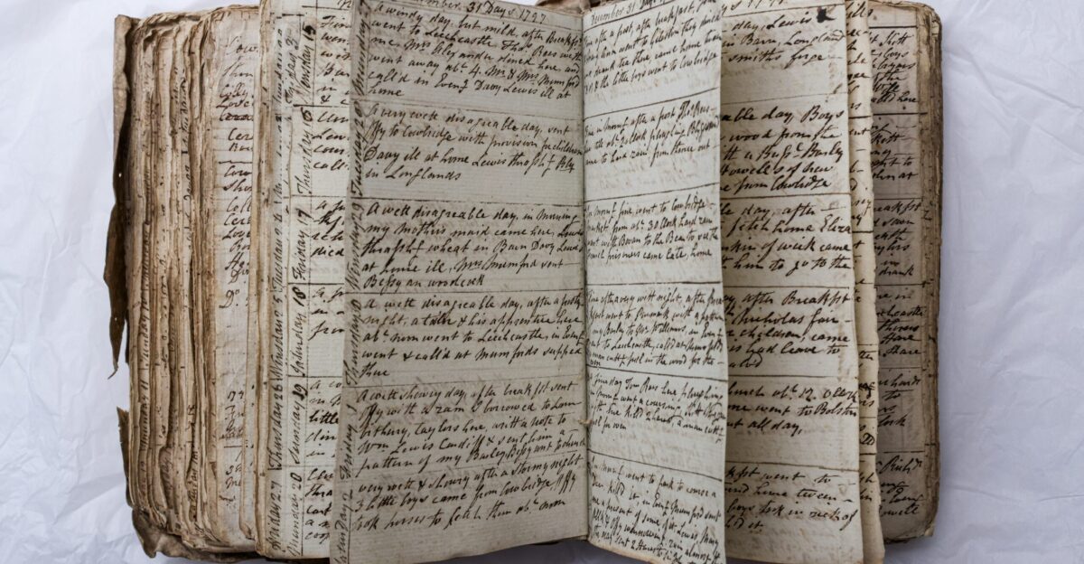 An old handwritten book is open to view