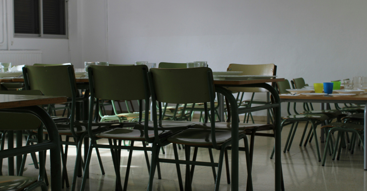 Empty classroom with chairs and tables.