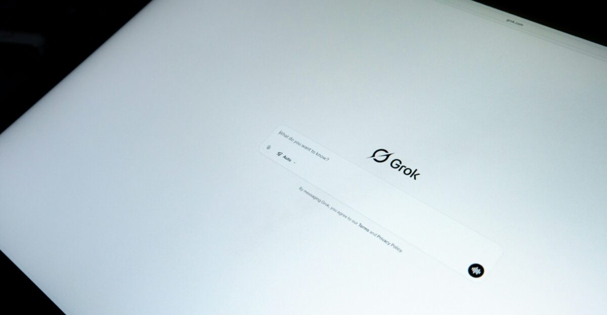 Close-up of a laptop screen with a logo