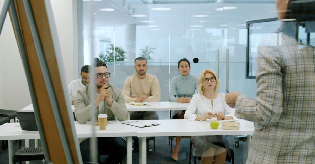 Business people attending a presentation in a modern office