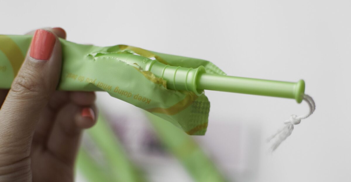 A Playtex tampon being taken out of its wrapping