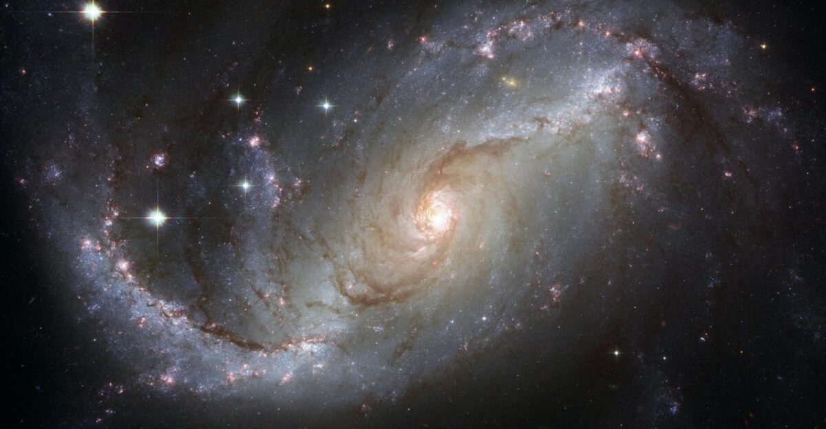 Capture of the NGC 1672 spiral galaxy showcasing its majestic spiral arms and bright core
