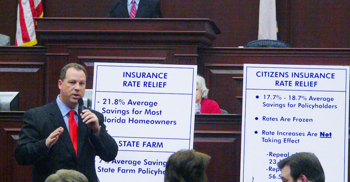 Policy and Budget Chairman Rep Ray Sansom R-Ft Walton Beach offers an overview on the House floor of the savings to Florida citizens if the compromise insurance relief measures under consideration were to be approved Monday Jan 22 2007 in Tallahasee Florida Top shows House Speaker Marco Rubio R-Miami while right shows Rep Adam Hasner R-Delray Beach