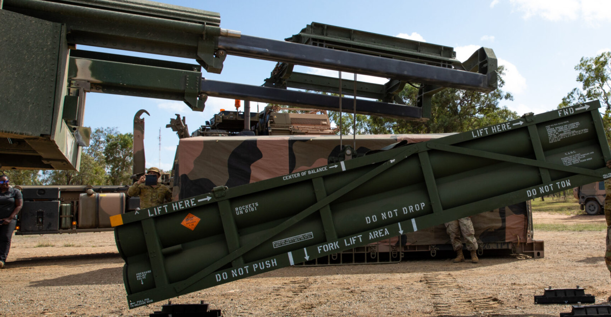 U.S. Army Staff Sgt. Jimmy Lerma, crew chief for Alpha Battery, 1st Battalion, 3rd Field Artillery Regiment, 17th Field Artillery Brigade, adjusts the Army Tactical Missile System (ATACMS) for loading on to the High Mobility Artillery Rocket System (HIMARS) in support of Talisman Sabre 2023 at Williamson Airfield in Queensland, Australia on July 26, 2023. Talisman Sabre is the largest bilateral military exercise between Australia and the United States advancing a free and open Indo-Pacific by strengthening relationships and interoperability among key allies and enhancing our collective capabilities to respond to a wide array of potential security concerns. (U.S. Army photo by Sgt. 1st Class Andrew Dickson)