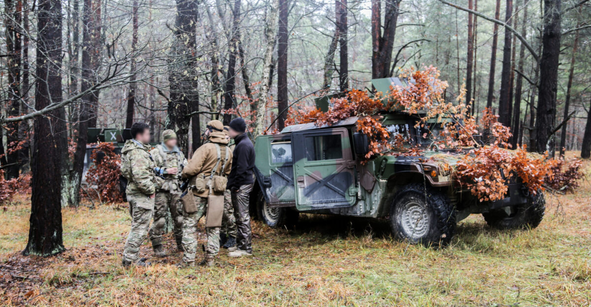 Ukrainian Special Operations Forces and U S Army Special Forces Soldiers assigned to 10th Special Forces Group Airborne discuss reconnaissance operations during exercise Combined Resolve XI at the Joint Multinational Readiness Center in Hohenfels Germany December 3 2018 During Combined Resolve XI an exercise with over 5 500 participants from 16 nations SOF conducted operations in enemy-occupied territory to support and interoperate with conventional forces U S Army photo by SPC Austin Thomas