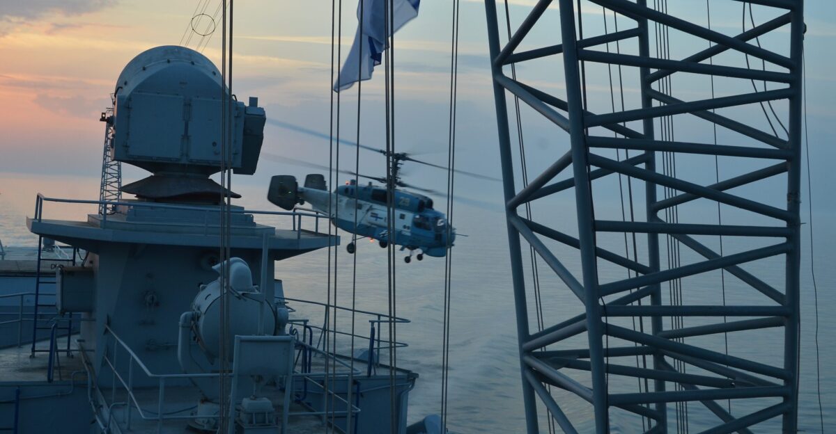 Ukrainian navy frigate Hetman Sahaydachniy and Ukrainian navy Ka-27 Helix helicopter