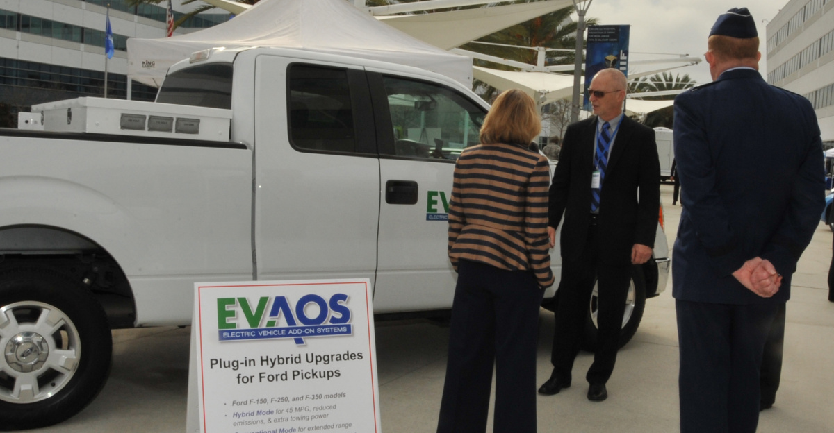 Assistant Secretary of the Air Force for Installations, Environment and Energy, Miranda A.A. Ballentine, greets vendors during the unveiling of the first federal facility, Los Angeles Air Force Base in El Segundo, Calif., to replace its entire general-purpose fleet with plug-in electric vehicles at a media event Nov. 14, 2014. The base's electric vehicle fleet consisting of 42 vehicles, including sedans, pick-up trucks and mini vans, of which 36 will be V2G-capable, is the largest operational vehicle-to-grid (V2G) demonstration in the world. (U.S. Air Force photo by Sarah Corrice/Released)