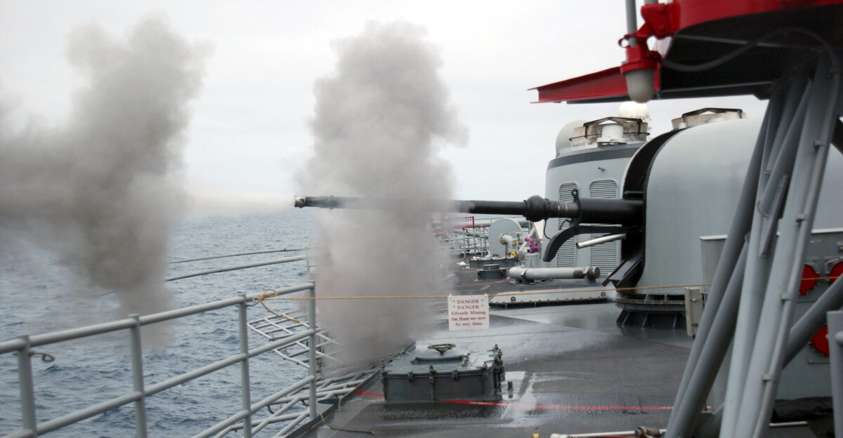 Pacific Ocean Oct 9 2002 - The 76mm rapid-fire gun aboard the guided missile frigate USS Sides FFG 14 is fired at the destroyer Towers DDG 9 during a live fire sinking exercise SINKEX conducted off the California coast Using decommissioned ships for live-fire operations gives ships crews the experience of launching operational weapons and honing their war-fighting skills The decommissioned ships are first made environmentally safe prior to towing and sinking in safe waters off prospective coastlines Ultimately the Towers will serve as a man-made reef for marine life in the area U S Navy photo by Photographer s Mate Airman Andrew Betting RELEASED