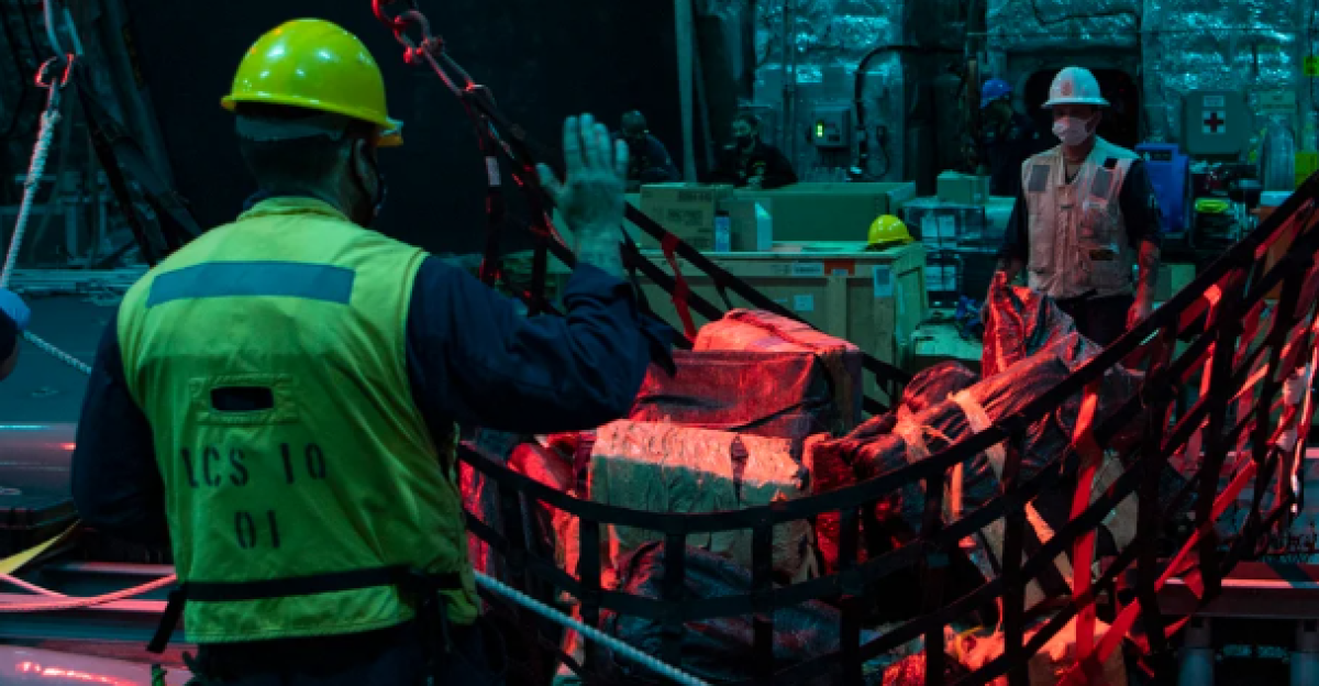 The crew of the U.S. Navy littoral combat ship USS Gabrielle Giffords (LCS-10) and the embarked U.S. Coast Guard Law Enforcement Detachment (LEDET) transfer suspected contraband after intercepting a narco-submarine in the eastern Pacific Ocean.