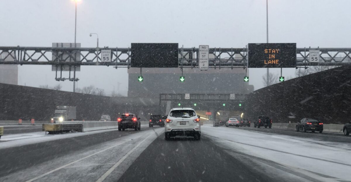 View south along Interstate 95 just before entering the Fort McHenry Tunnel in Baltimore City Maryland during a snow shower