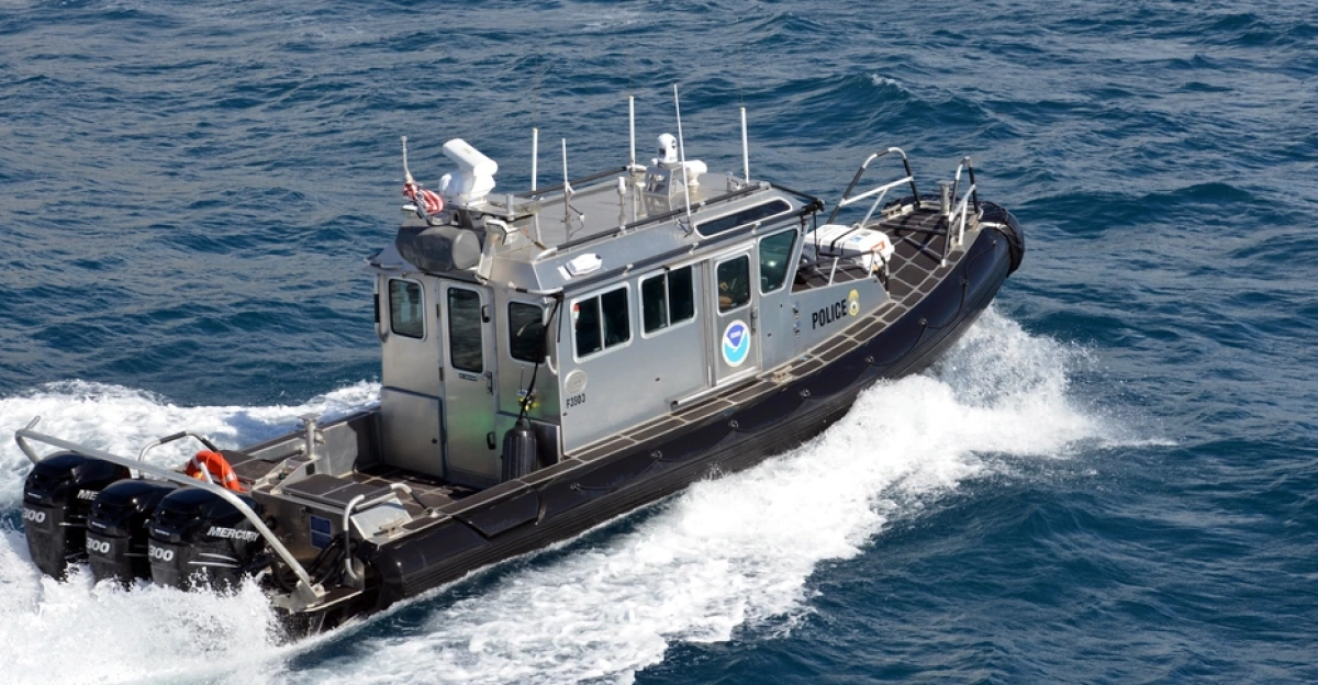 A National Oceanic and Atmospheric Administration (NOAA) law enforcement boat patrols offshore during Operation Kohola Guardian in Maui, Hawaii, Feb. 14, 2017.