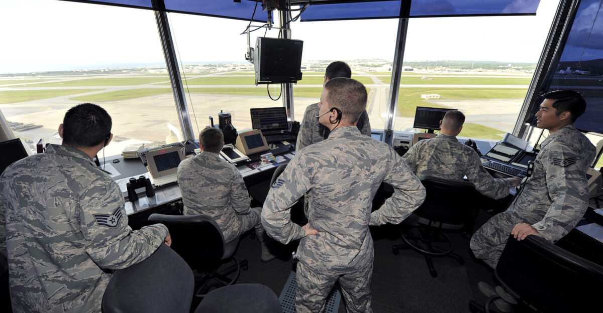 Air traffic controllers from the 18th Operations Support Squadron visually scan the Kadena flight line for safety risks in the ATC tower Nov 30 2015 at Kadena Air Base Japan Air traffic controllers require extensive training so they can ensure the safety of flight operations for multiple airframes while minimizing delays U S Air Force photo by Naoto Anazawa Unit 18th Wing Public Affairs