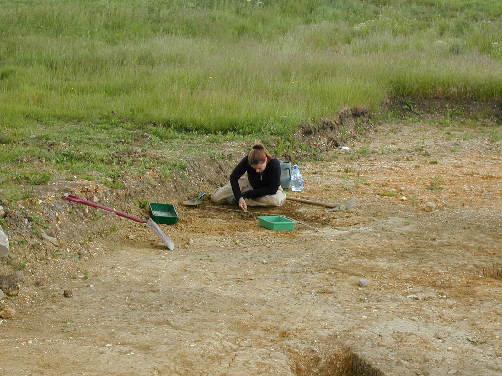 Archaeologist excavating at the Stratton deserted medieval village project 1990-2001