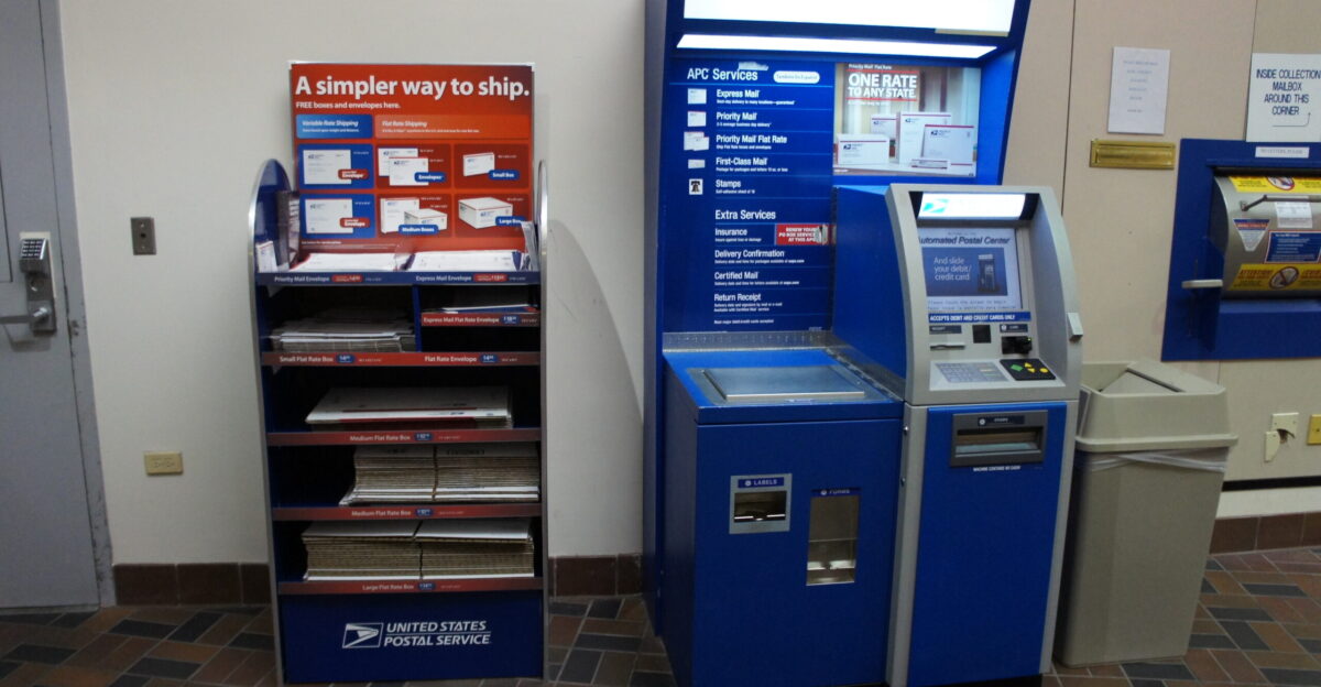 The automated postal center is a custom-made platform by Wincor-Nixdorf based on one of their indoor ATM designs a version of which can often be seen as a Chase ATM inside certain Target stores It has an online internet-based connection that according to the guy servicing it interacts with postal systems in Washington D C through a secure connection The scale on the left was custom made just for the Post Office It can support up to 200lbs is accurate to a fraction of an ounce and is legal for trade The scale is the big metal square on the left there are also ruler markings embossed onto the metal edging on the platform There are three thermal label printers on the bottom The leftmost slot dispenses package labels these are the common 4 x6 vertical labels you see with the address and confirmation barcodes The one labeled forms in the middle dispenses a combined Return Receipt and Certified Mail labels the same label prints if you buy any of these services and it has instructions on how to tear off and apply only the one s you ve paid for Both of these print from rolls The postage slot underneath the screen dispenses 18-stamp ATM stamp panes of Forever Stamps It can also dispense other denominations of stamps as IBI-stamps on tiny slips of sticker paper that are about 1 5 by 3 The IBI Information Based Indicia stamps have an DataMatrix barcode similar to the ones seen on the 4 x6 labels and on postage meters however these stamps can be used at any time Like PC postage stamps APC stamps identify packages from a known mailer and may be used to mail items over 13 ounces without taking the package to a retail counter This is because the APC takes your photo and only accepts credit debit cards The camera is the black square under the screen in the center of the APC and captures a still image when you reach the payment options screen These images are retained for an unknown amount of time the postal employee said he didn t know how long to deter fraud and prohibited materials The APC also has software that measures the image and will not let you proceed to the payment screen if the image is too dark or the camera is not functional So if you want to anonymously mail a bunch of fireworks and illegal drugs with your boss s credit card you re out of luck Available services include Sending Domestic mail at most retail rates including Package Services First Class Priority and Express as long as it fits in the special chute at the right Sending International mail for envelopes containing documents and correspondence only Delivery Confirmation Insured Mail Certified Mail Return receipt electronic and physical Calculating rates for any package you are allowed to send with the APC Sending packages with partial postage already on it minimum purchase 1 00 Buying sheets of 18 Forever stamps Buying variable-denominated IBI postage stamps minimum total 1 00 Renew PO Box Postal services that the APC does NOT provide Signature Confirmation why - you may purchase a similar Return Receipt Electronic service only with Certified Mail or Insurance Over 200 International packages Registered Mail PO Box Application available on the web present ID to pick up keys Money Orders DineroSeguro or any other financial services Any packages that do not fit completed in the chute Note APC doesn t take cash There is a 1 minimum purchase for credit card transactions