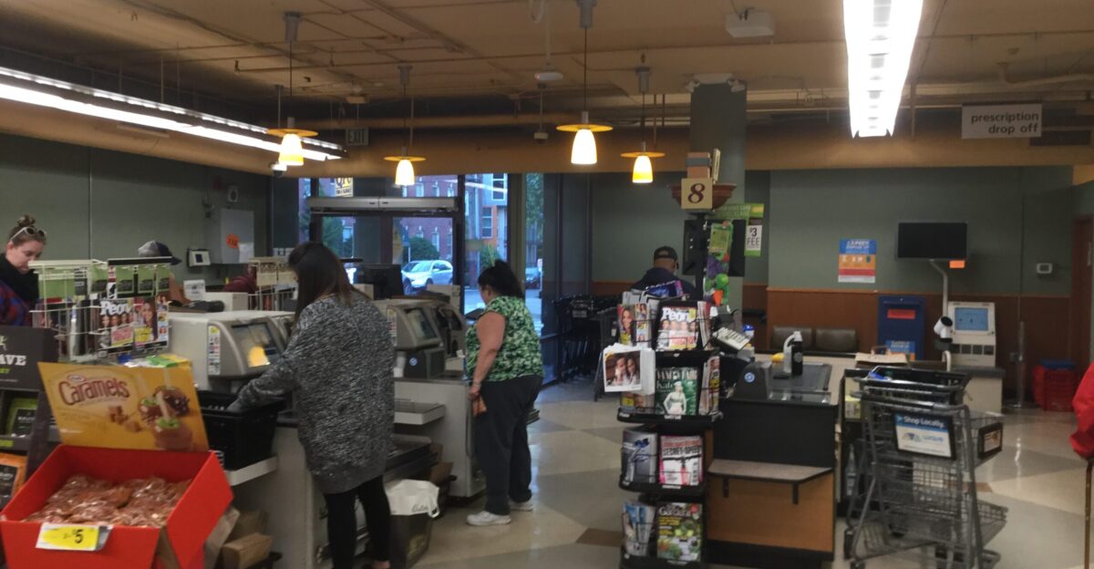 The back entrance to the store used to have a couple lonely checkouts - specifically four self-checkouts and the abandoned-looking register 8 Sadly the entrance closed recently in one of the rare cases that Kroger admitted to changing something due to theft Looking through the Capitol Hill Seattle Blog archives for QFC results in a lot of articles about theft and the resulting anti-consumer actions that Kroger keeps taking and somehow finding another justification for so this is quite surprising