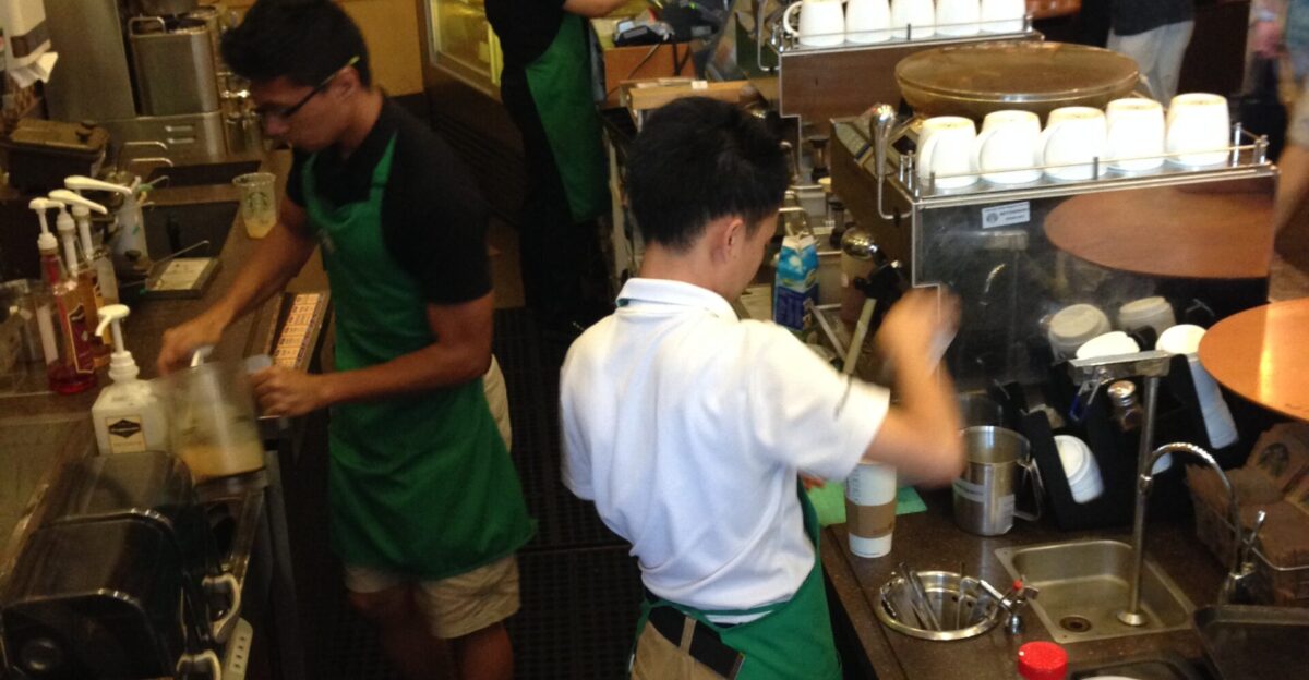 Baristas at work in Starbucks Coffee The Cathay Singapore