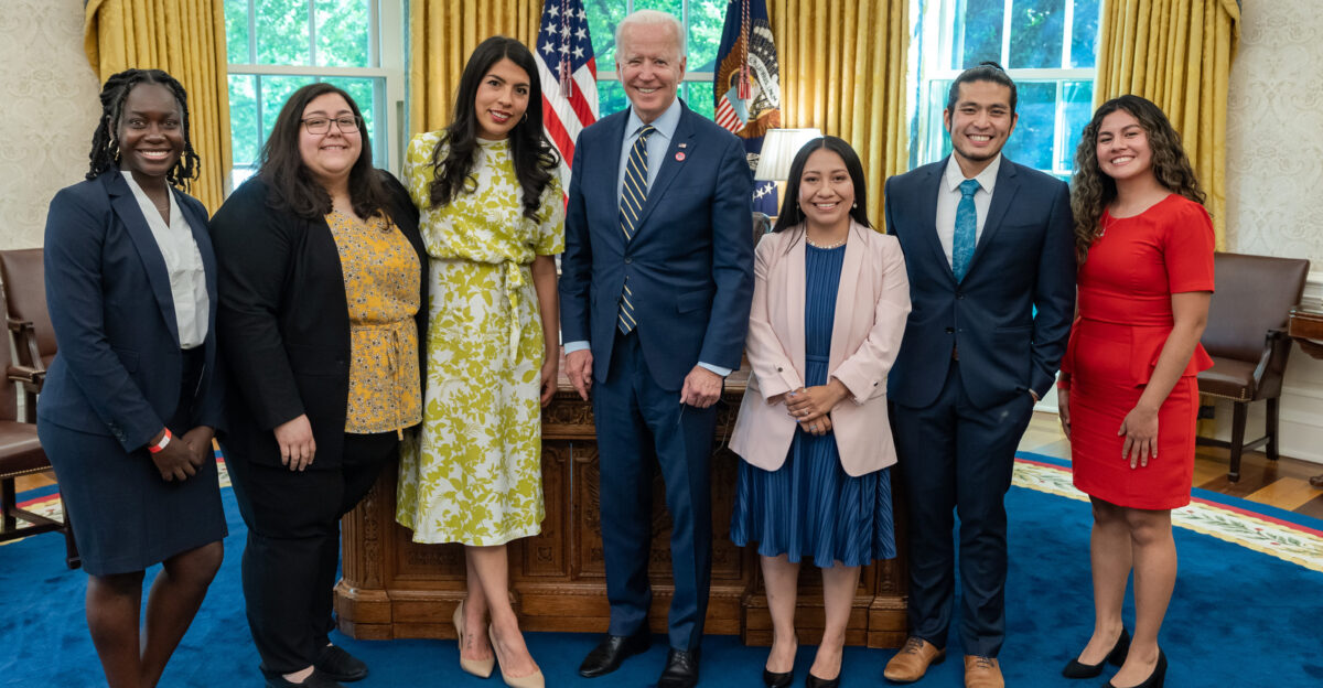 President Joe Biden poses for a photo during a meeting with DACA Deferred Action for Childhood Arrivals recipients to discuss the American Dream and Promise Act on Friday May 14 2021 in the Oval Office of the White House Official White House Adam Schultz