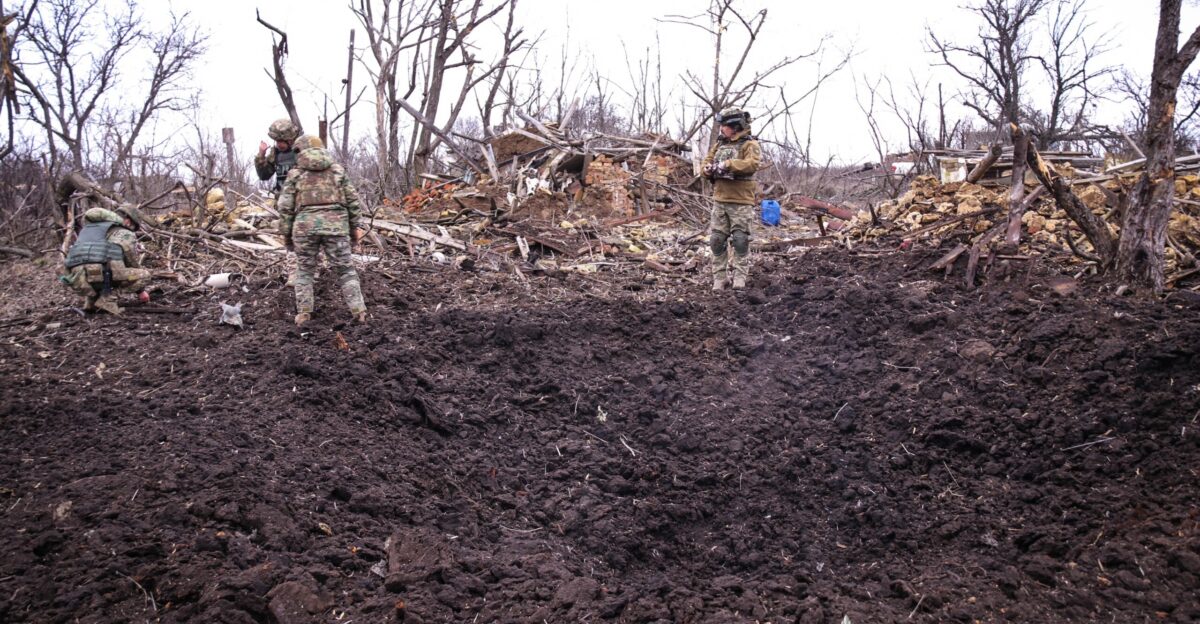 Sappers of Ukrainian police dispose non-exploded Russian air-dropped bomb FAB-500 ShR with 3 explosive parts found in a totally destroyed village of Beryslav district of Kherson region of Ukraine